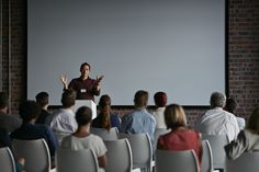 a man giving a presentation to an audience