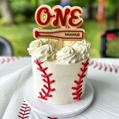 a baseball themed birthday cake with the number one on it's top and name