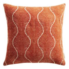 an orange and white pillow with wavy lines on the front, in a square shape