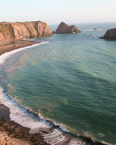 an aerial view of the beach and cliffs