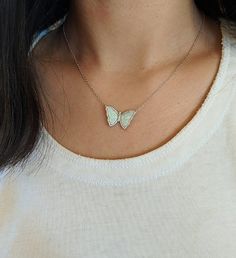 Dance in the moonlight | A KAMARIA best seller! This beautiful and delicate butterfly is made with lab- created opal and set in 925 sterling silver. The wings are surrounded with pave crystal. Pair with our opal chokers or your favorite silver chain. The 18 inch chain is sterling silver with an adjustable slider ball. | 1-800-Flowers Gifts Delivery Opal Butterfly By Kamaria White Opal Butterfly Necklace By Kamaria White Sterling Silver Butterfly Necklace With Clavicle Chain, White Sterling Silver Butterfly Necklace, Dance In The Moonlight, Delicate Butterfly, Dancing In The Moonlight, Flowers Gifts, Delivery Gifts, The Wings, Butterfly Necklace