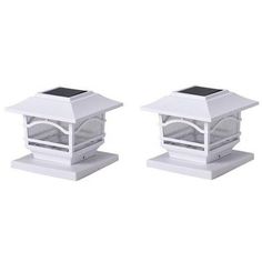 two white solar powered lights sitting on top of each other's bases in front of a white background