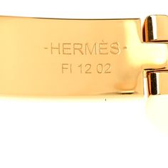 This is an authentic HERMES Enamel Mini Clic Chaine D'Ancre Farandole Bracelet GM in Creme. This chic bracelet is crafted of polished gold plated palladium, white enamel inlay, and a chaine d'ancre motif closure. Chic Bracelet, White Enamel, Gold Plate, Plating, Bracelet, Gold, White