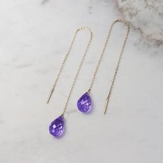 "\"A gold pair of threader earrings with a beautiful purple amethyst! February's birthstone is believed to bring warmth and strength to the person wearing it. They would make a unique birthstone gift for someone you love. Light and easy to wear all day long! Are they for you? Perfect! Simple and sophisticated, these earrings are aiming to make your day stable and peaceful!\" --Fairy Goldcharm ♥♥ CUSTOMIZATION ---> Available in yellow, white, or rose gold. ---> Isn't amethyst your birthston Dainty 14k Gold Purple Jewelry, Dainty Purple 14k Gold Jewelry, Yellow Gold Threader Earrings As A Gift, Yellow Gold Threader Earrings For Gift, Yellow Gold Amethyst Teardrop Earrings, 14k Gold Dangle Threader Earrings As Gift, 14k Gold Drop Threader Earrings For Gift, 14k Gold Tarnish Resistant Threader Earrings As Gift, Amethyst Drop Jewelry In Yellow Gold