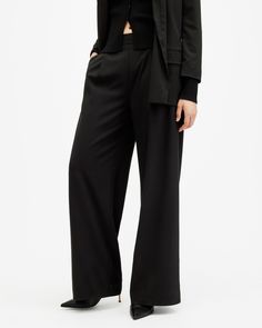 AllSaints tailoring. The Aleida Pants are crafted from a fluid fabric that's super easy to wear. Sitting mid-rise on the waist with flowing wide leg shaping. They've got an easy fit that can easily be taken from day-to-night.   These pants are designed to a regular fit Mid-rise Two side pockets Two back pockets Elasticated waist band Wide leg shape Modern Wide Leg Pants With Elastic Waistband, Versatile Wide-leg Dress Pants With Relaxed Fit, Sleek Tailored Wide Leg Pants, High-waisted Viscose Wide Leg Pants For Work, Formal Wide-leg Pants With 4-way Stretch, Formal Wide Leg 4-way Stretch Dress Pants, Formal Viscose Wide Leg Pants, Formal Wide Leg Dress Pants With 4-way Stretch, Formal Wide-leg Dress Pants With 4-way Stretch