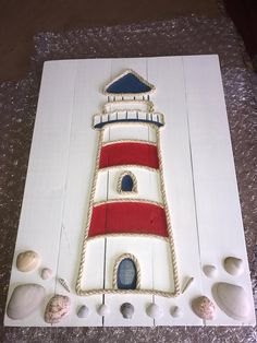 a cake made to look like a lighthouse with red, white and blue icing