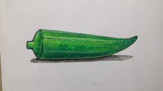 a drawing of a green object on a white paper