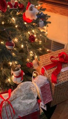 a christmas tree with presents under it