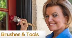 a woman holding a paintbrush in front of a red door with the words brushes & tools on it