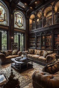 a living room filled with lots of furniture next to a large stained glass window covered in bookshelves