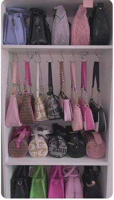 a white shelf filled with lots of purses