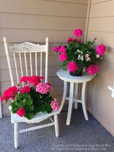 two white chairs sitting next to each other with pink flowers on them and one has a potted plant in it