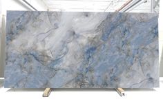 a blue marble counter top with measurements for the size and color, shown in front of a white background