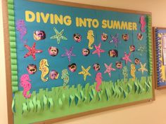 a bulletin board is decorated with paper cut outs and sea animals on the bottom, along with words saying diving into summer