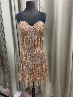 Beautiful fringe gold dress Y2K. Size 8 Mini Length Beaded Fringe Dress For Party Season, Fitted Fringe Mini Dress For Gala, Glamorous Fringe Dress For Cocktail, Glamorous Fringe Cocktail Dress, Glamorous Tassel Dress For Night Out, Sleeveless Beaded Fringe Dress For Gala, Sleeveless Beaded Fringe Gala Dress, Cocktail Mini Dress With Beaded Fringe, Cocktail Mini Dress With Fringe