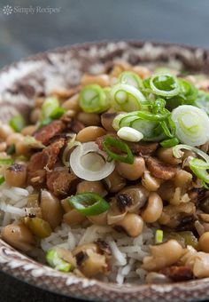 a bowl filled with rice and beans on top of a table