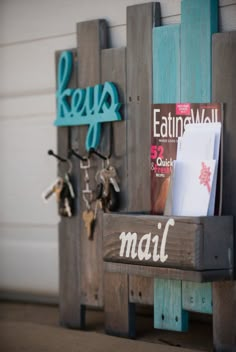 a couple of wooden boards holding magazines and keys