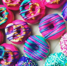 there are many colorful donuts with sprinkles on them