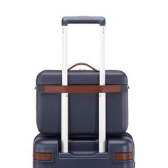 a piece of luggage with two handles and brown straps on the front, sitting upright