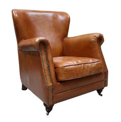 a brown leather chair sitting on top of a white floor