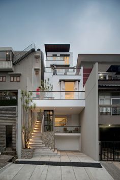 an apartment building with stairs leading up to it