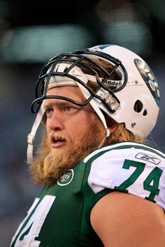 a man with a beard wearing a football uniform