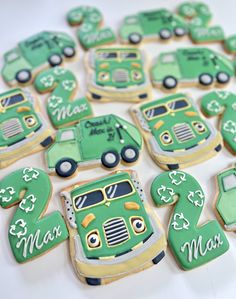 decorated cookies are arranged in the shape of cars