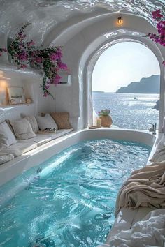 an indoor jacuzzi is shown with flowers in the window