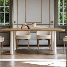 a dining room table with four chairs around it