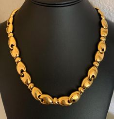 This high quality Monet signed 1/2 inch wide bright gold link necklace is 22 inches long and 1/2 inch wide.  It has a strong hook and chain clasp.  It is classic and in wonderful condition.  The signature is on the hook. I specialize in finding fun wearable jewelry.  My shop has a sterling silver section.  Please browse my shop for more options. Luxury Gold Necklace With Large Beads, Classic Gold Chain Necklace With Hooks And Links, Vintage Gold Necklace With Hooks And Links, Vintage Gold Necklace With Hook And Links, Wearable Jewelry, Gold Link Necklace, Le Crochet, Gold Link, Bright Gold