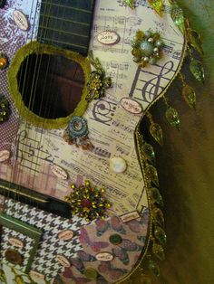 an image of a decorated guitar on flickr's mobile phone screen, taken from above