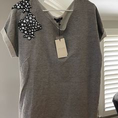 100% Cotton, Heather Gray, Beautiful Short Sleeved Blouse With Beading Across The Front And Back Right Shoulder. Elegant Embellished Cotton Tops, Fall Embellished Tops For Work, Embellished Short Sleeve Tops For Spring, Spring Embellished Short Sleeve Tops, Casual V-neck Sequined Tops, Casual Sequined V-neck Top, Embellished Crew Neck Blouse For Spring, Short Sleeved Blouse, Floral Chiffon Blouse