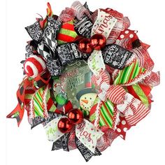 a christmas wreath with candy and decorations on it