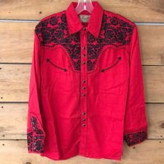 New With Tags 65% Polyester, 35% Rayon Imported Button Closure Machine Wash 65% Polyester / 35% Rayon Long Sleeve Floral Tooled Embroidery (Front/Back) And Cuff. Red Embroidered Long Sleeve Shirt, Fitted Embroidered Red Shirt, Fitted Red Embroidered Shirt, Western Dress Shirts, Western Style Shirt, Fourth Of July Shirts, Denim Button Down, Western Shirt, Western Dresses