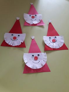 four paper hats made to look like clowns