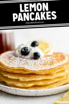 lemon pancakes with blueberries and whipped cream on top