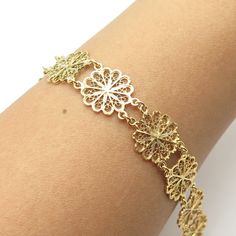 Great vintage condition.  925 Sterling Silver Gold Plated Vintage Filigree Floral Link Bracelet 7.5"  Weight: 10.8g   WELCOME TO PAWN SHOP We are an actual pawn shop and have been in business for over 25 years. Since 1990, our establishment has been serving a variety of clients by providing them with short term cash solutions and options of liquidity regarding their treasured heirlooms. Acknowledging that today′s customers are very sophisticated and are looking for a variety of investments, our Gold Sterling Silver Wedding Bracelet With Intricate Design, Gold Sterling Silver Bracelet With Intricate Design For Wedding, Ornate Yellow Gold Bracelets, Wedding Gold Filigree Bracelet, Vintage Gold Sterling Silver Hallmarked Bracelet, Vintage Hallmarked Gold Sterling Silver Bracelet, Ornate Gold Bracelet For Wedding, Hallmarked Gold Sterling Silver Bracelet, Gold Sterling Silver Bracelet Hallmarked