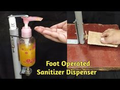 a hand sanitizer dispenser is being used to clean someone's hands