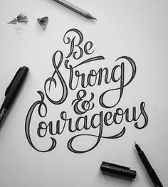 the words be strong and courageous written in cursive writing