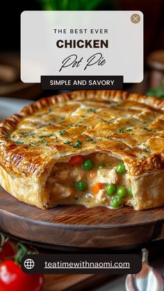 the best ever chicken pot pie with peas and savory on a wooden platter