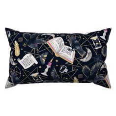 an image of a pillow with books and birds in the night sky on black background