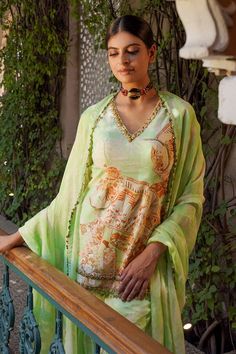 Green kurta featuring floral mix printed motifs and sequin embellishments. Comes with matching gharara and sequin embellished dupatta. - Aza Fashions Bollywood Style V-neck Sets For Eid, Semi-stitched V-neck Designer Wear Sets, Semi-stitched V-neck Sets For Festive Occasions, Festive V-neck Sets For Eid, Anarkali Sets With Resham Embroidery And V-neck, Diwali V-neck Sharara With Dupatta, Festive V-neck Sharara With Dupatta, Designer V-neck Sets For Eid, V-neck Sharara With Zari Work For Diwali