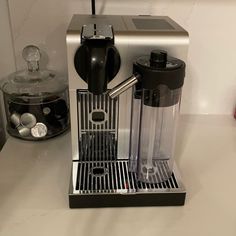 an espresso machine sitting on top of a counter