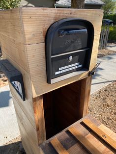 a mailbox is built into the side of a wooden box