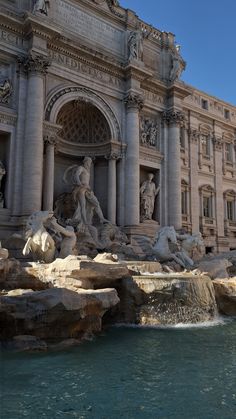 the trellotto fountain in front of an ornate building