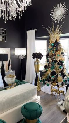 a black and white christmas tree in a living room with green accents on the walls