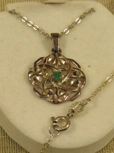 Silver marked 925 NY near the clasp (seen in close up).  Celtic knot with shamrocks set with a center green stone (quite possibly an emerald).  A very thin and delicate chain, 18 3/4 inches long.  Pendant measures 3/4 inches across. Silver Shamrock, Trinity Knot, Delicate Chain, Celtic Jewelry, Long Pendant, Knot Necklace, Celtic Knot, Green Stone, Necklace Etsy