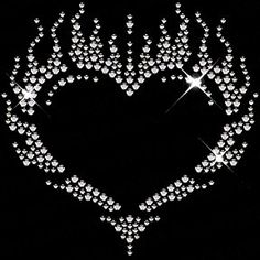 a heart made up of diamonds on a black background with the words love written in it