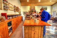 a man standing at a counter in a store