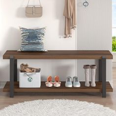 a wooden bench sitting next to a white rug on top of a hard wood floor